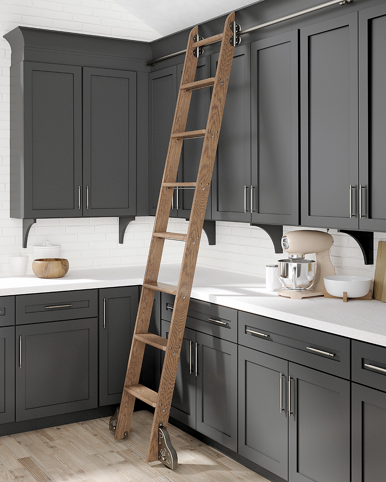 Classic No. 1 kitchen cabinet ladder A Putnam Classic No. 1 ladder serving as a kitchen cabinet ladder in a kitchen with charcoal gray cabinets, white counters, and light wood floors